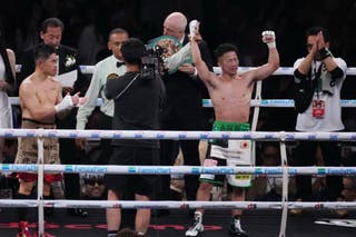 Takuma Inoue sees his hand raised